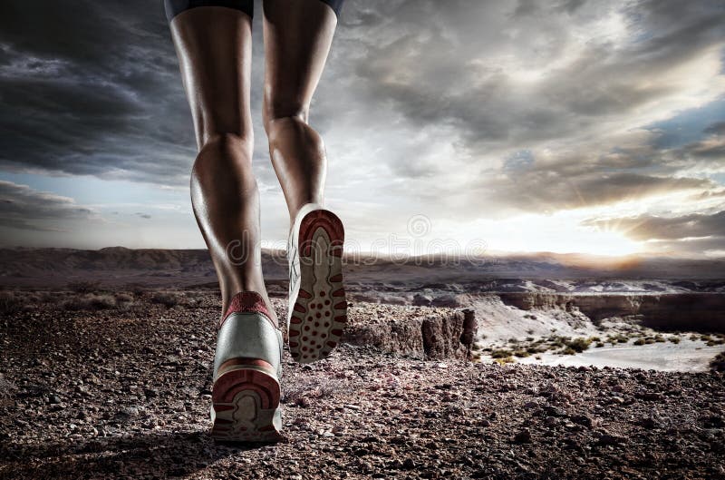 Sports background. Runner feet running on road closeup on shoe. Sports background. Runner feet running on road closeup on shoe.