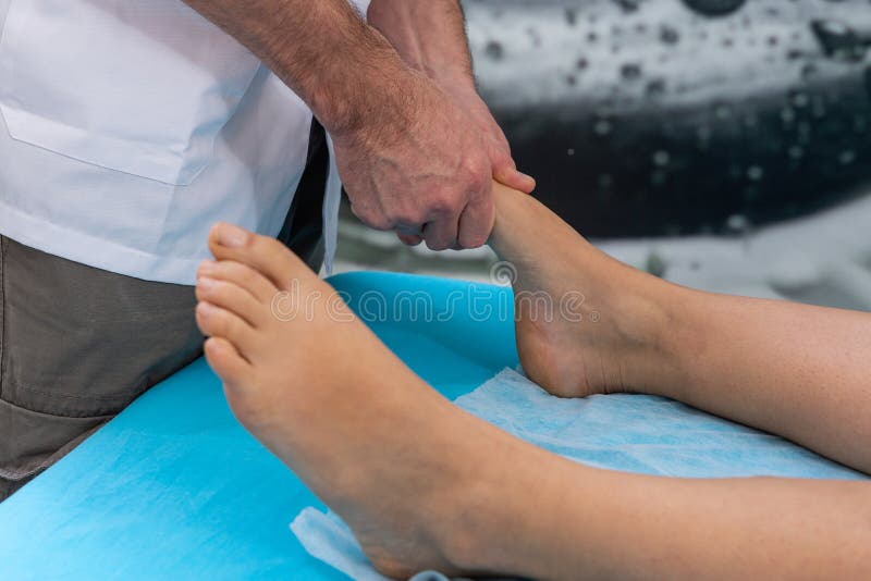 Osteopath Therapist Makes Manipulation and Massage To Foot the Patient