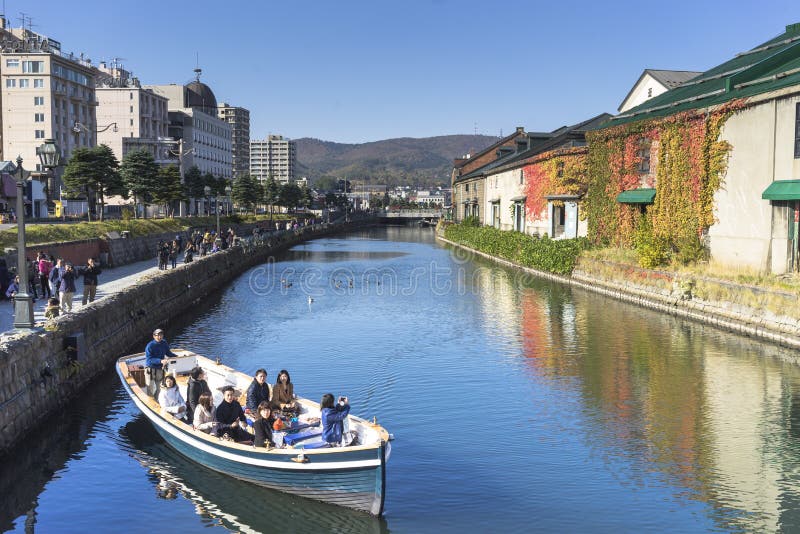 Otaru, Japan - October 19, 2017 : Unknown tourists on Otaru canal cruise, bright beautiful autumn day. royalty free stock photo Otaru, Japan - October 19, 2017 : Unknown tourists on Otaru canal cruise, bright beautiful autumn day. royalty free stock photo