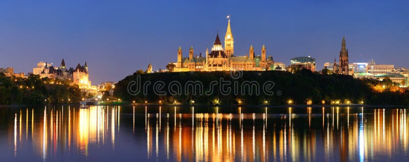 Ottawa at night over river with historical architecture. Ottawa at night over river with historical architecture.