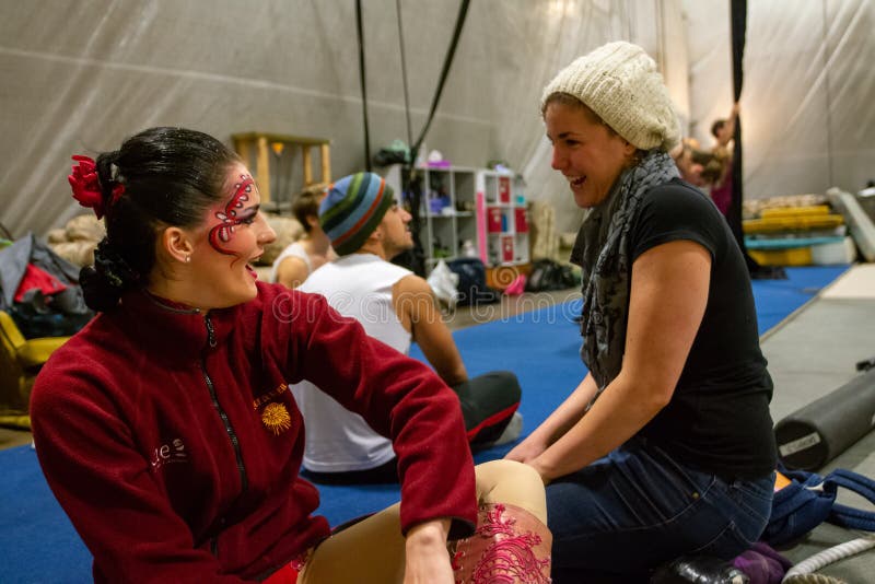 MONTREAL, CANADA - Oct 19, 2012: Montreal, Quebec / Canada - October 19 2012: Young Women Laugh Together in a Circus Gym. MONTREAL, CANADA - Oct 19, 2012: Montreal, Quebec / Canada - October 19 2012: Young Women Laugh Together in a Circus Gym