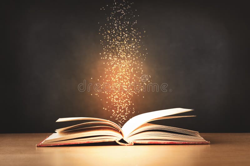 An old, worn, red text book, lying opened on a classroom desk with sparkles and stars rising upwards from its centre. Black chalkboard background. An old, worn, red text book, lying opened on a classroom desk with sparkles and stars rising upwards from its centre. Black chalkboard background