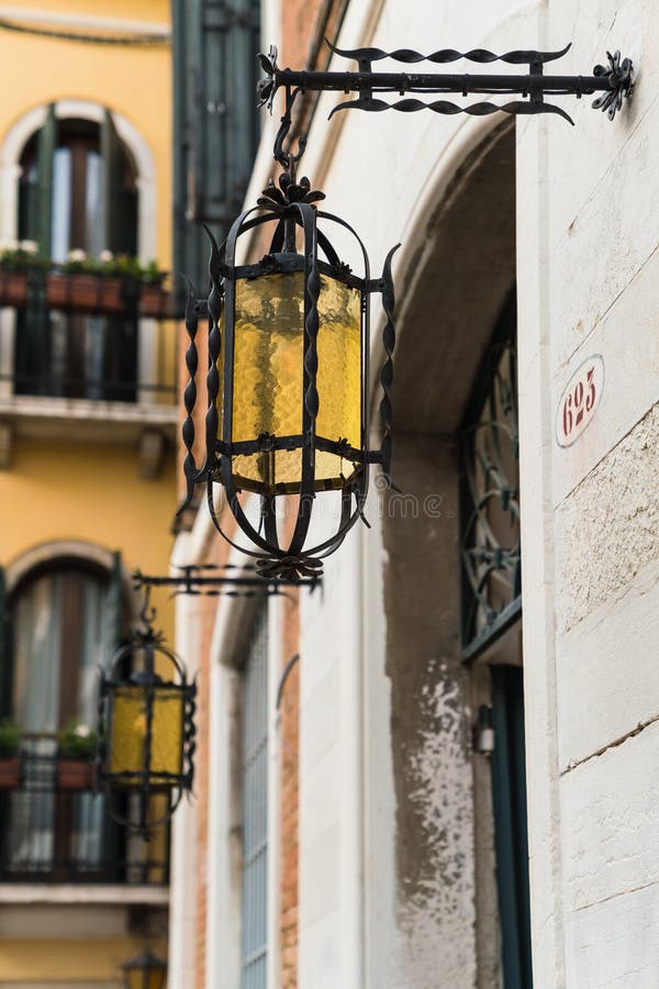 High Contrast Lighting Photo of a charming Narrow Street and Canal in Venice, Italy. High Contrast Lighting Photo of a charming Narrow Street and Canal in Venice, Italy