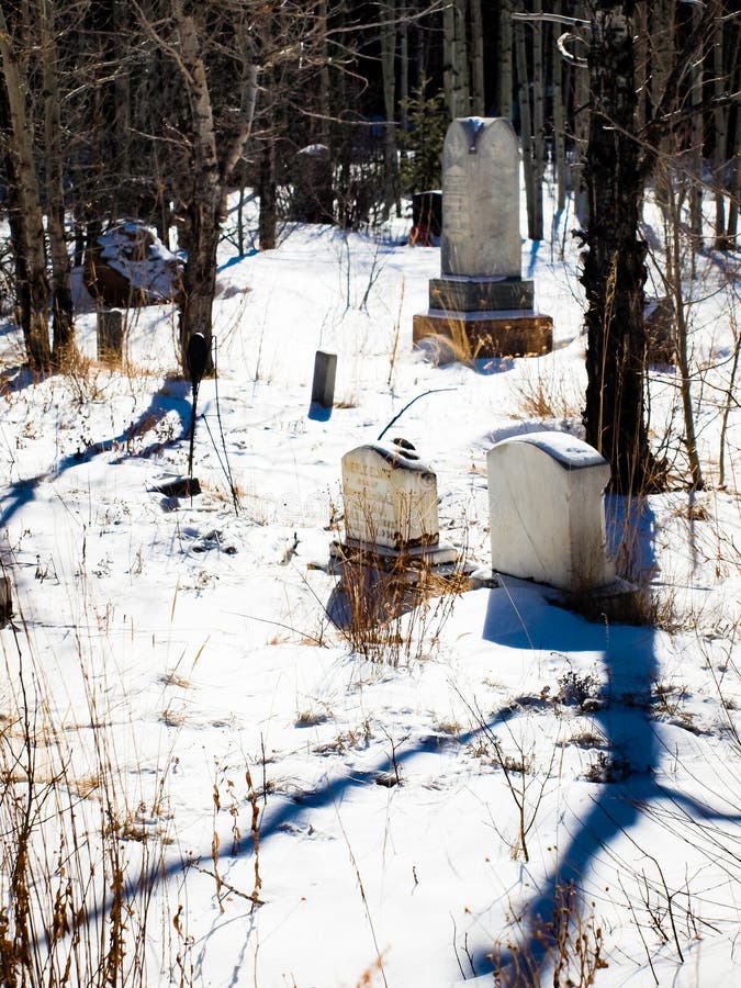 Georgetown, Colorado-January 17, 2012: Alvarado cemetery from 1800s near Georgetown, Colorado. Georgetown, Colorado-January 17, 2012: Alvarado cemetery from 1800s near Georgetown, Colorado.