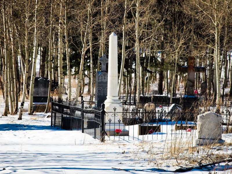 Georgetown, Colorado-January 17, 2012: Alvarado cemetery from 1800s near Georgetown, Colorado. Georgetown, Colorado-January 17, 2012: Alvarado cemetery from 1800s near Georgetown, Colorado.