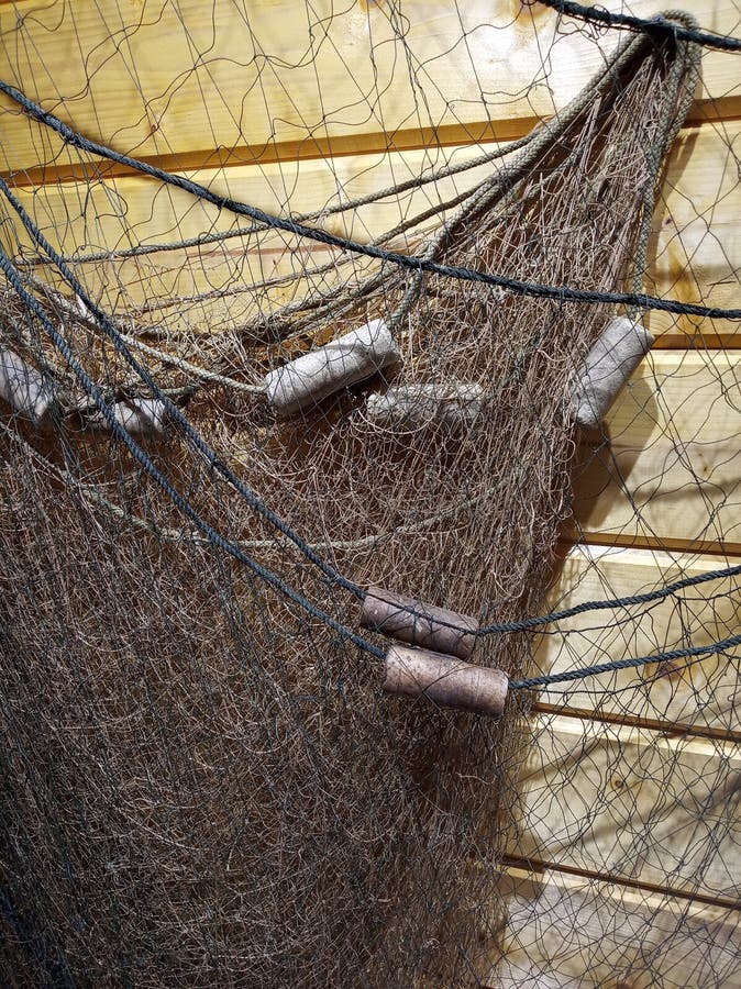 Photo of old fishing net on the wall. Photo of old fishing net on the wall