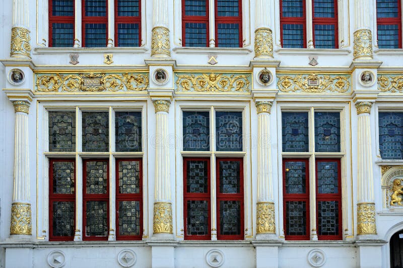 The famous medieval Burg square in Bruges (Brugge) in Belgium. This are beautiful windows of the Oude Griffie, the old chambers . Belgium. The famous medieval Burg square in Bruges (Brugge) in Belgium. This are beautiful windows of the Oude Griffie, the old chambers . Belgium