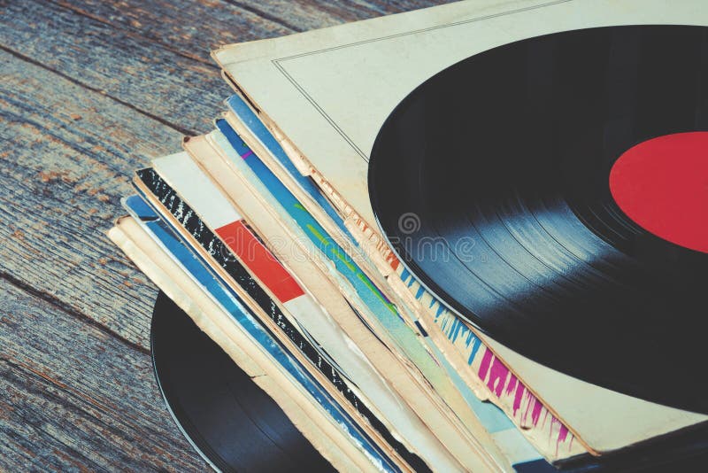 Pile of old vinyl records on the table. Pile of old vinyl records on the table