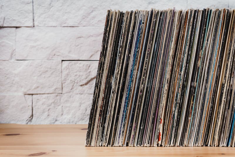 Wooden shelf full of old vinyl records. Wooden shelf full of old vinyl records