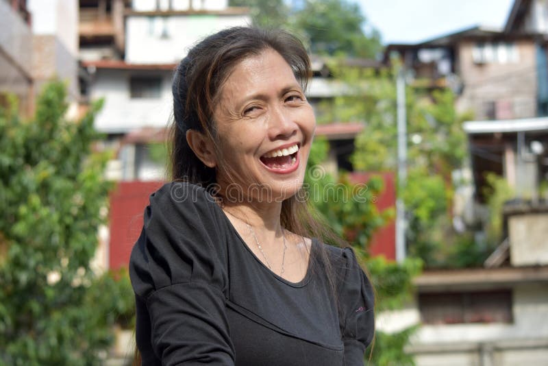 An Ouder Filipina Female Senior Laughing Stock Foto Image Of