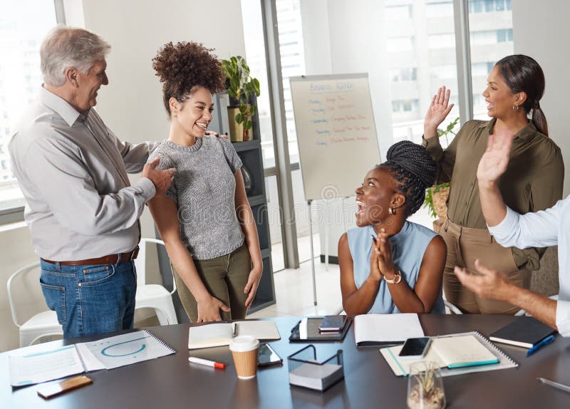 This is our new team member. a group of businesspeople clapping hands in a boardroom at work. Boardroom table clapping stock images, royalty-free photos and pictures