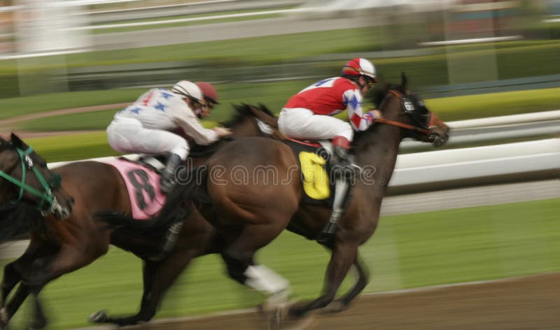 Abstract motion blur of racing jockey leading the field in a thoroughbred horse race. Abstract motion blur of racing jockey leading the field in a thoroughbred horse race.