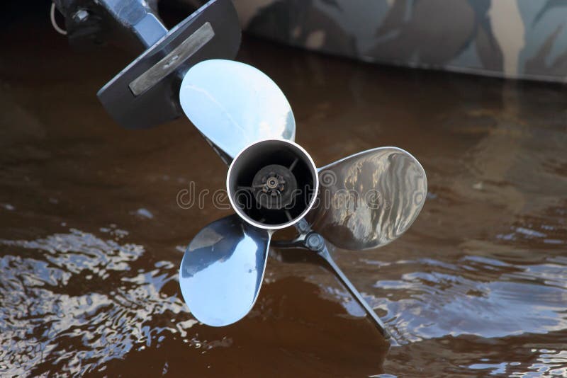 Outboard motor boat propeller on water