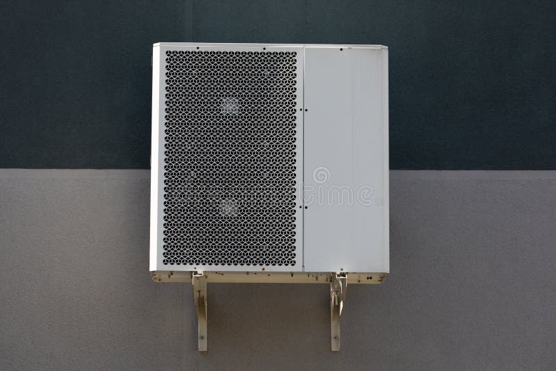 Outdoor Air Conditioner Unit on the Wall of a Building Stock Photo