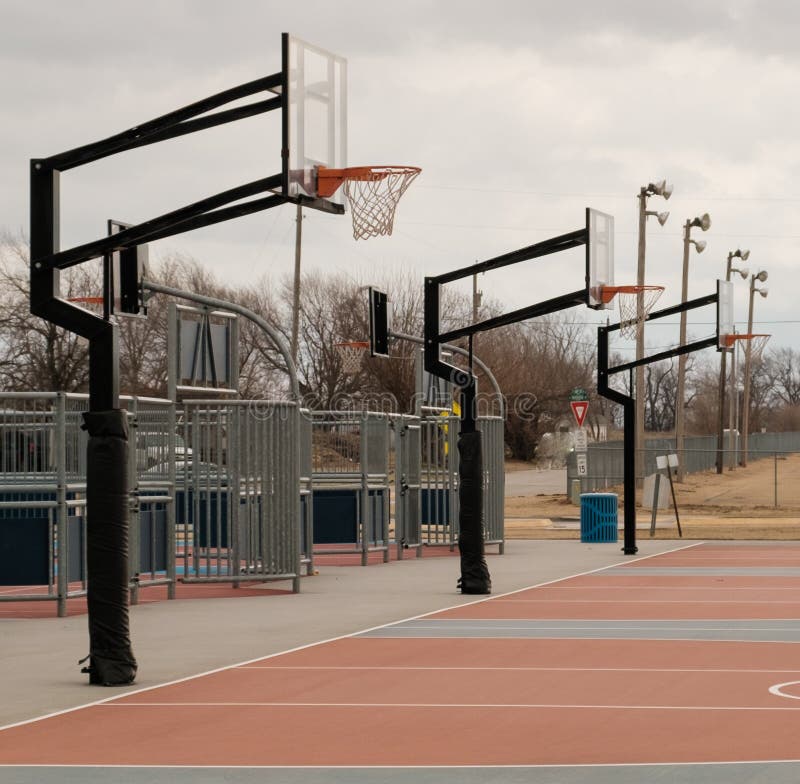 Outdoor Basketball Goals on a Cloudy Day Stock Photo - Image of court