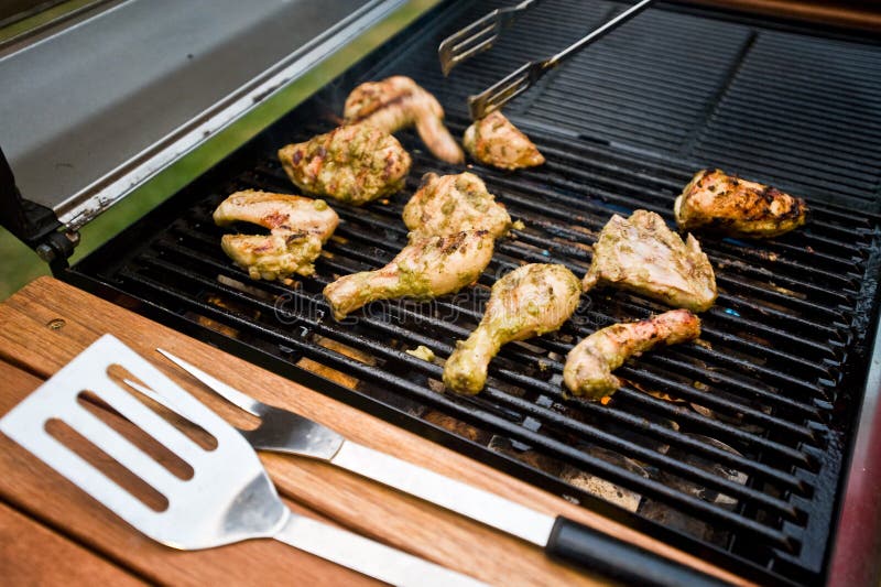 Outdoor BBQ of chicken pieces on hot grill. Roasted skewer grill stock images, royalty-free photos and pictures