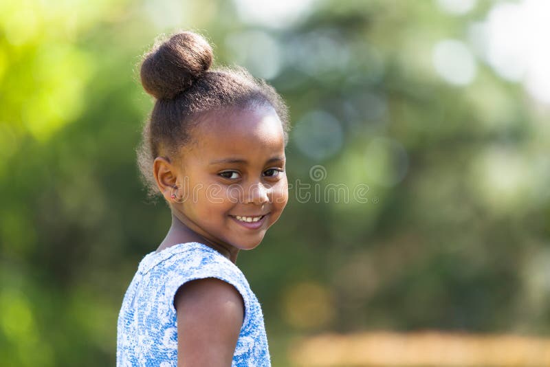 Outdoor close up portrait of a cute young black girl - African p royalty free stock photography Outdoor close up portrait of a cute young black girl - African p royalty free stock photography