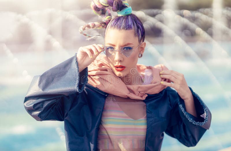 Outdoor close up portrait of a young lady with crazy look. Fashionable girl posing on street. Model girl wearing stylish stock photography Outdoor close up portrait of a young lady with crazy look. Fashionable girl posing on street. Model girl wearing stylish stock photography