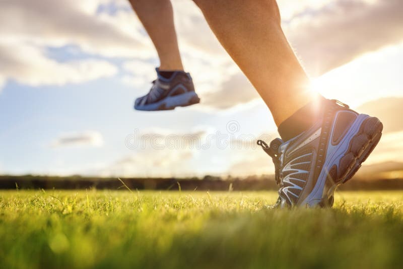 Running trail run in early sunrise. Outdoor cross-country running in early sunrise concept for exercising, fitness and healthy lifestyle royalty free stock photos Running trail run in early sunrise. Outdoor cross-country running in early sunrise concept for exercising, fitness and healthy lifestyle royalty free stock photos