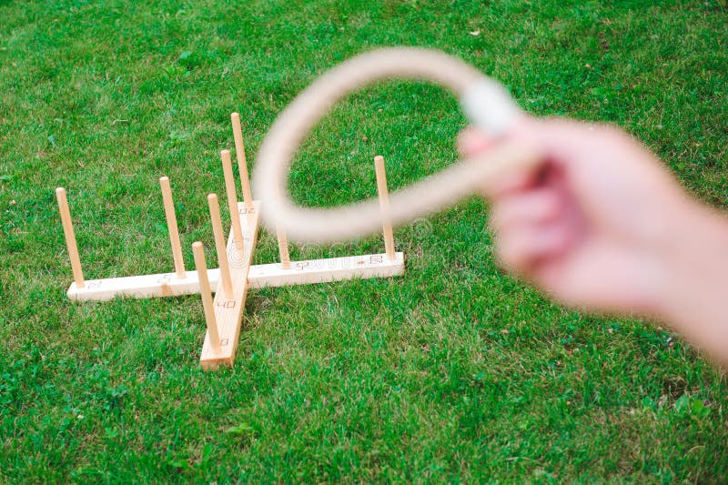 Outdoor Games Guy Playing Ring Toss in a Park. Stock Photo Image of