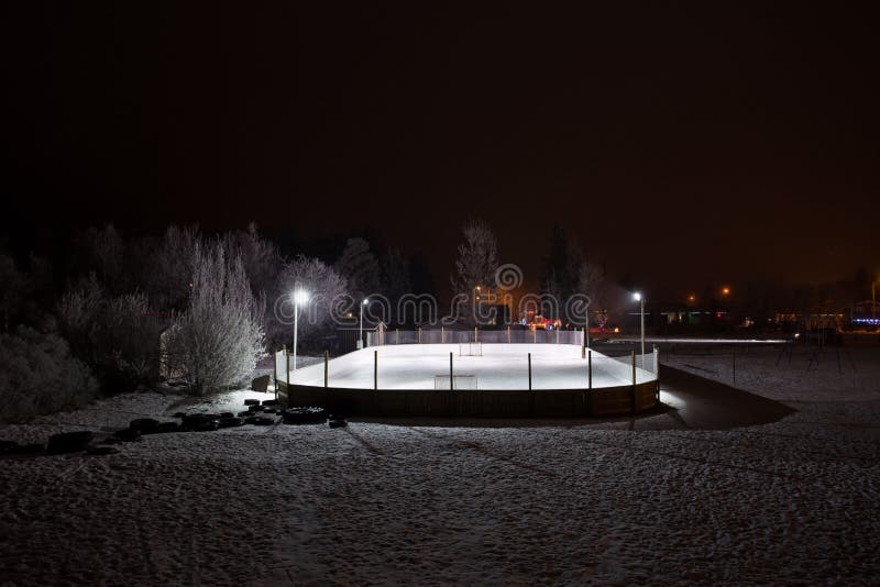 Outdoor hockey rink at night