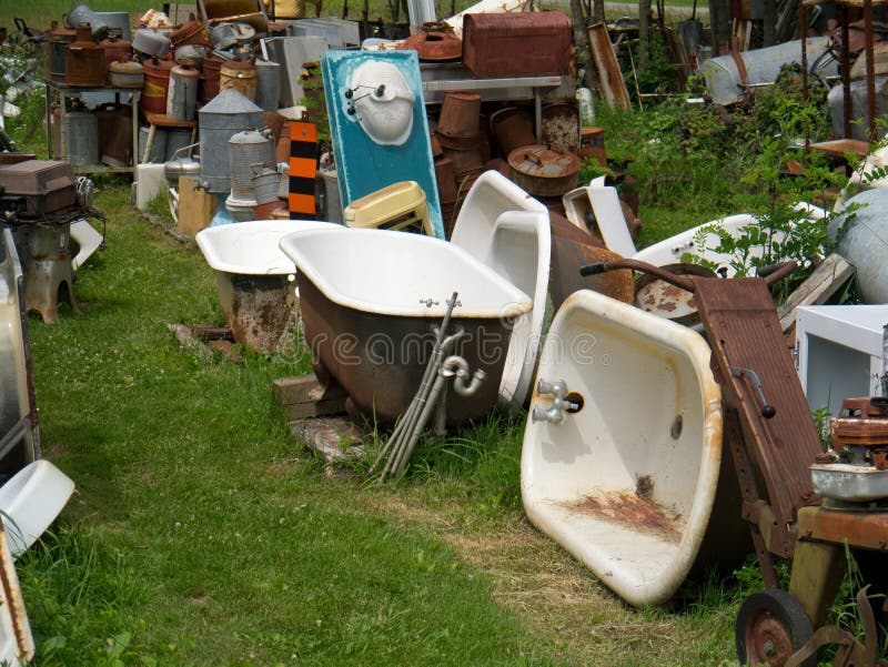 Outdoor Junk Yard stock photo. Image of bathtubs, bathtub 27193110