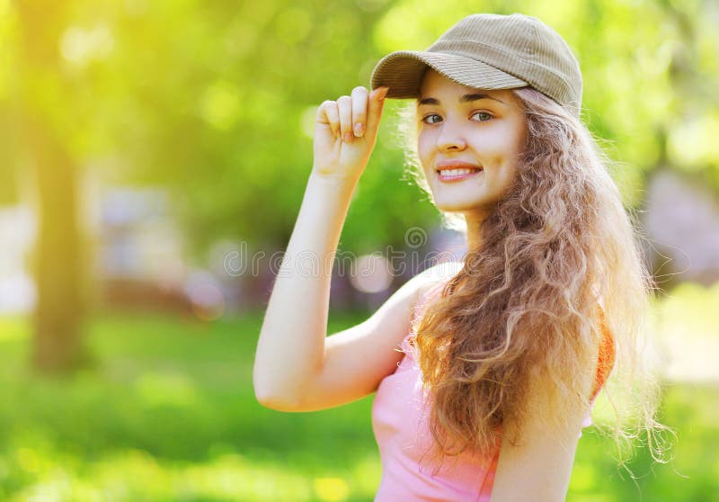 Outdoor lifestyle summer portrait pretty happy young girl with c