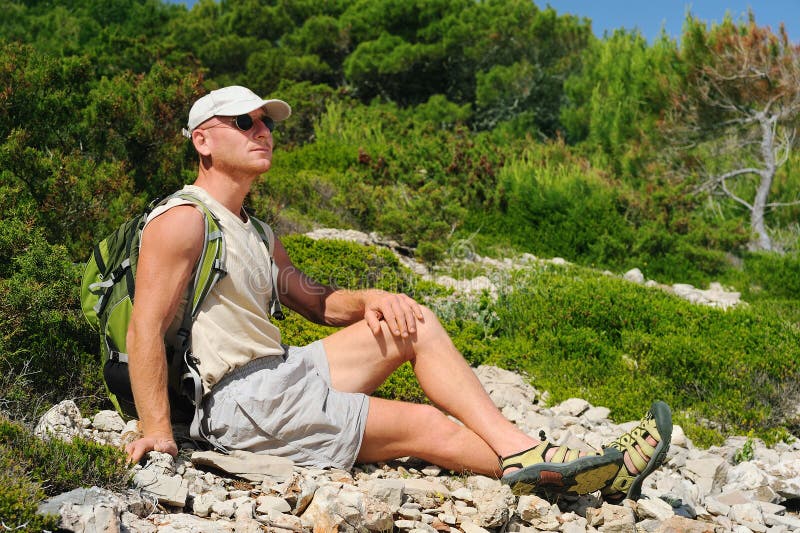 Outdoor Man Resting on Rock after Hiking Stock Image Image of island