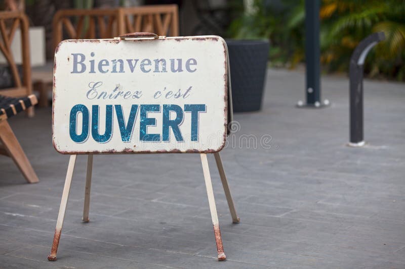 Sign at the entrance of a restaurant saying in French - Ouvert - meaning in  English - Open Stock Photo - Alamy