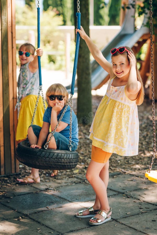 Outdoor portrait of 3 funny kids