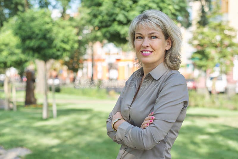 Outdoor portrait of mature businesswoman on city street royalty free stock photos Outdoor portrait of mature businesswoman on city street royalty free stock photos