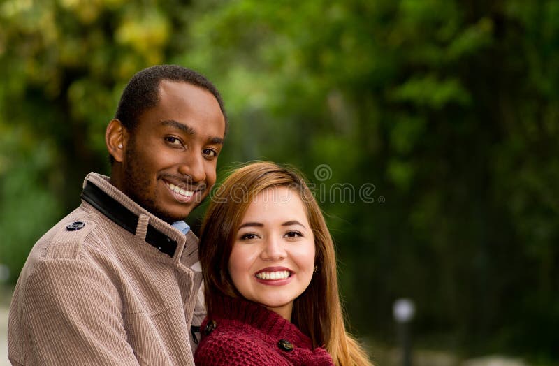 Outdoor Portrait Of Romantic And Happy Interracial Young Couple In Park Stock Image Image Of