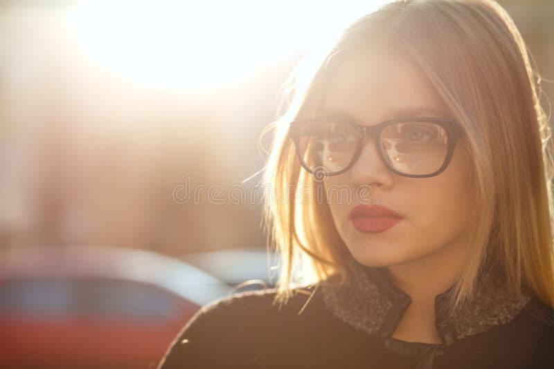 Outdoor Portrait Of Seductive Blonde Girl Wearing Glasses And Co Stock