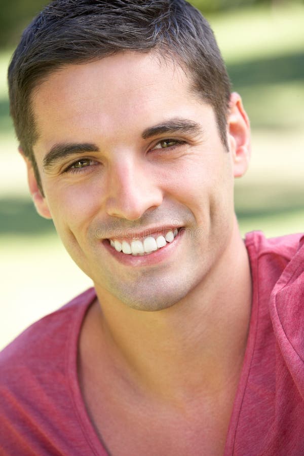 Outdoor Portrait Of Smiling Young Man