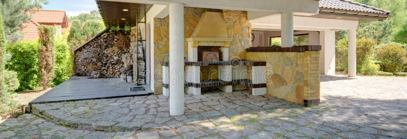 Outdoor relaxation area with fireplace royalty free stock images