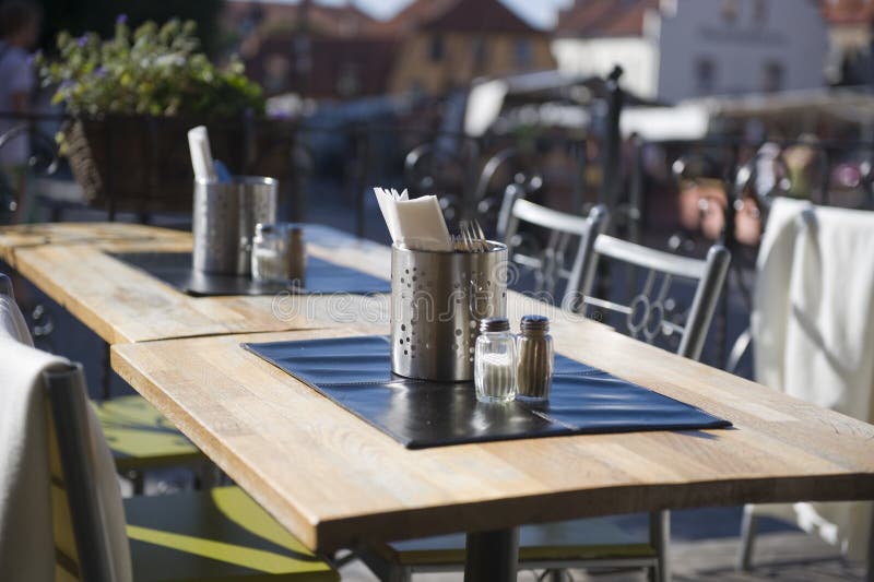 Outdoor restaurant table stock photo. Image of pepper 10771456