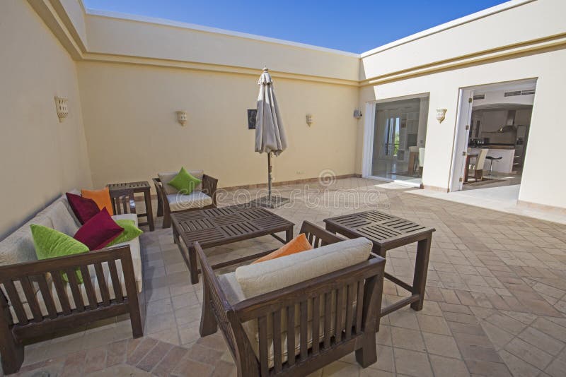 Outdoor seating area at luxury tropical holiday villa.