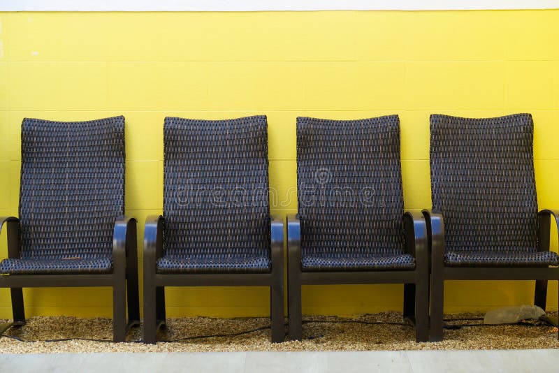 Outdoor Seating with Vivid Yellow Wall Stock Photo Image of seats