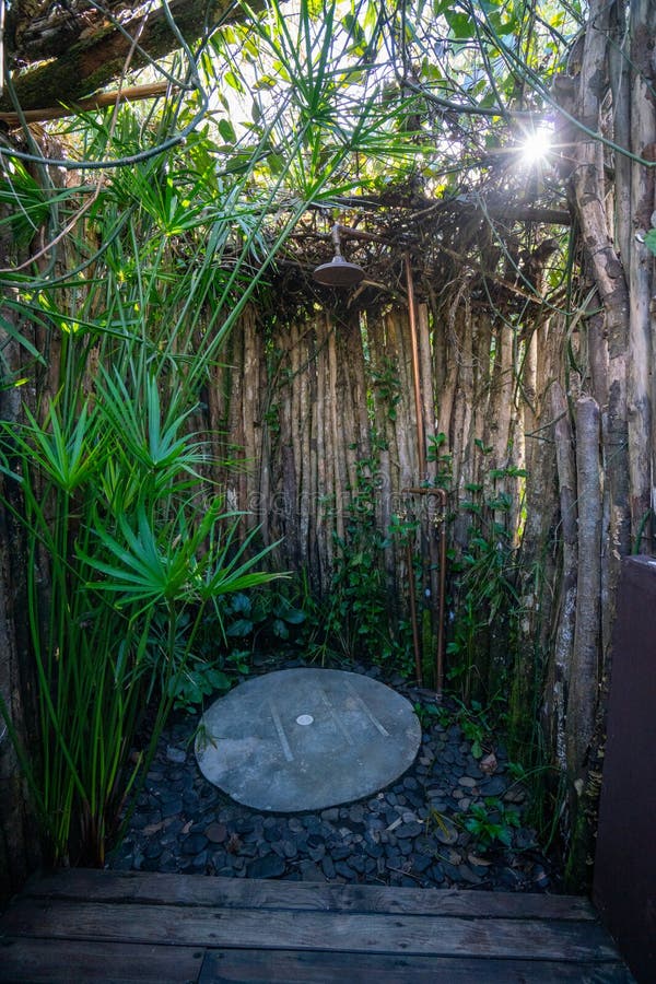 Outdoor Shower in Nature Reserve Surrounded by Trees and Bamboo Stock
