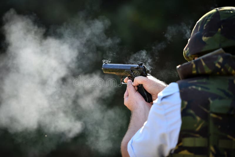 Outdoor Shooting with a 9mm Pistol in a Shooting Range Stock Photo - Image  of black, fire: 148350130