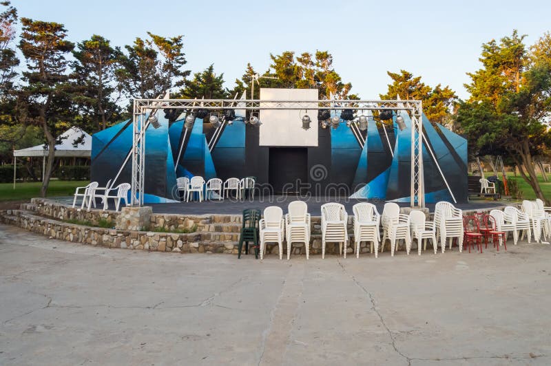 Outdoor theater podium with trees in background in northern