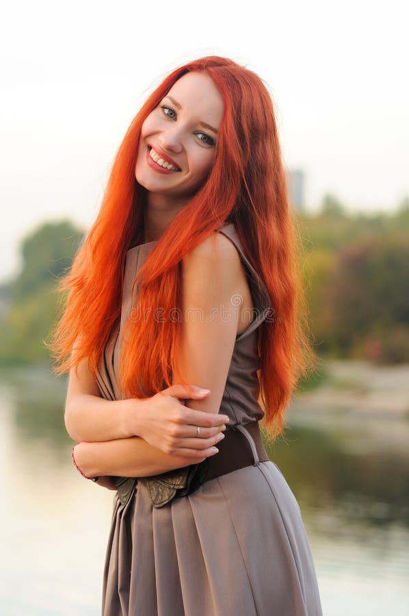 Outdoors portrait of beautiful young woman with red hair royalty free stock photos Outdoors portrait of beautiful young woman with red hair royalty free stock photos