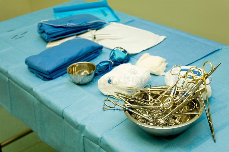 Some surgical tools over a sterile blanket. Some surgical tools over a sterile blanket