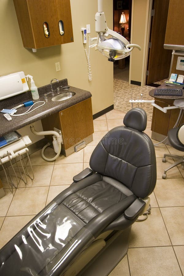 Dentist chair and tools in a dentist office. Dentist chair and tools in a dentist office