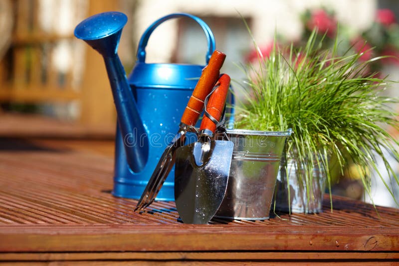 Gardening tools in garden background. Gardening tools in garden background