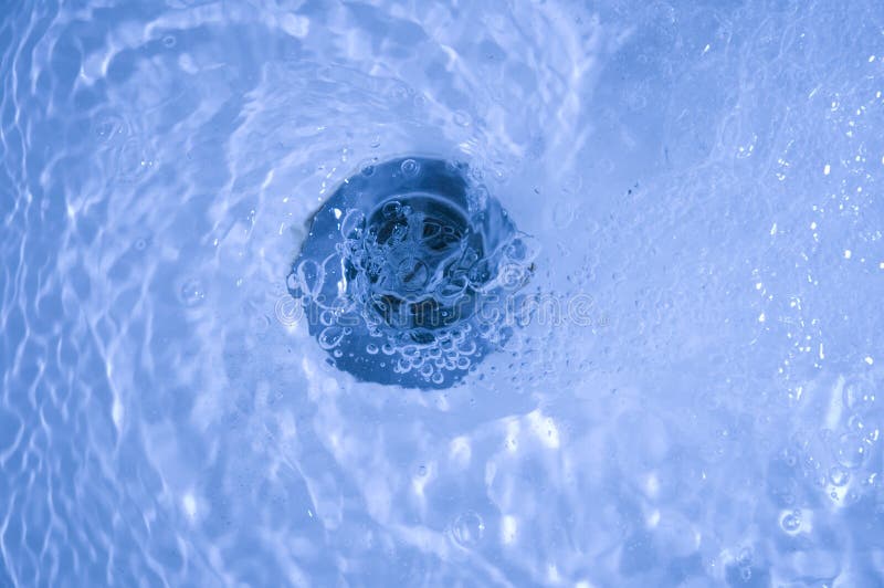 Close-up of bath tub sink with water running away. Whirlpool vortex water stock images, royalty-free photos and pictures