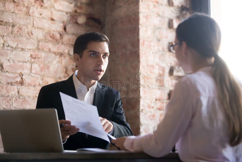 Outrage boss talking to employee, pointing to error in document. Young women gets scolded by chef. Business partner dissatisfied with terms and conditions of contract, client complaining concept.
