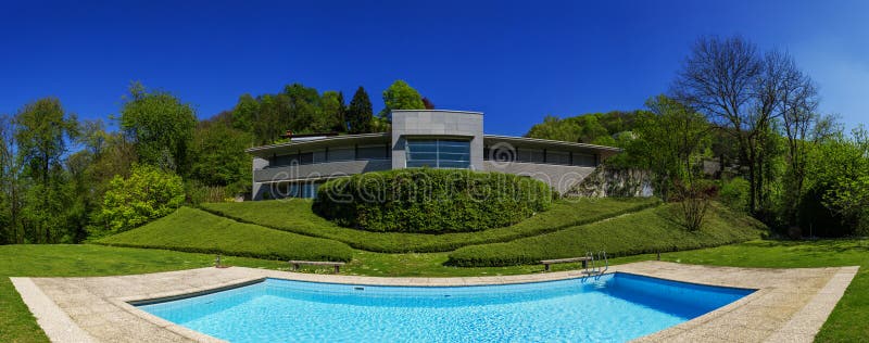 Outside of modern house in summer, swimming pool