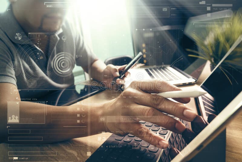 Outsource Developer working on marble Desk Working Laptop Computer Mobile Application Software and digital tablet dock smart royalty free stock photo