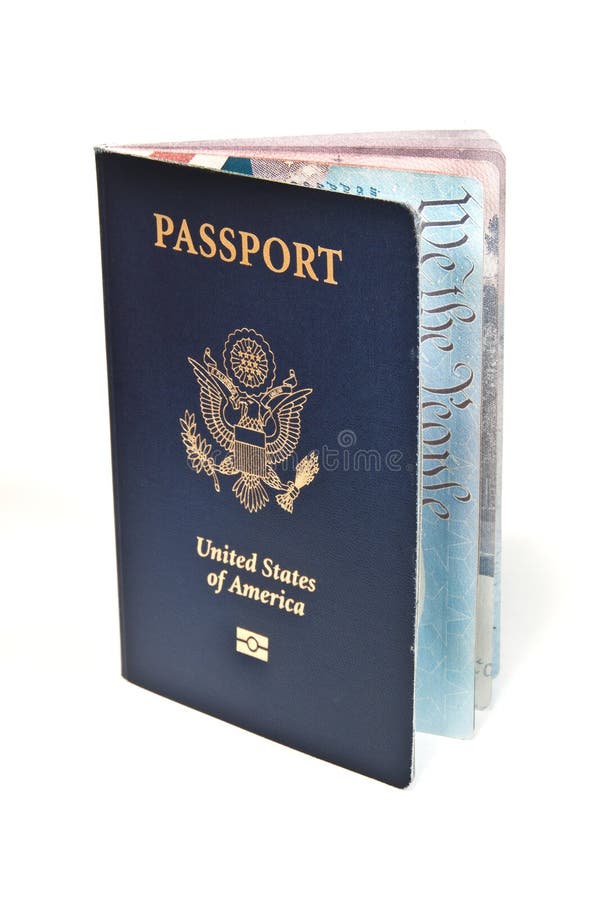 Close up of new American Passport standing upright slightly open showing we are the people on a inside page. Close up of new American Passport standing upright slightly open showing we are the people on a inside page.